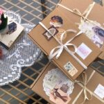 Charming gift boxes with vintage embellishments and lace on a decorative table.